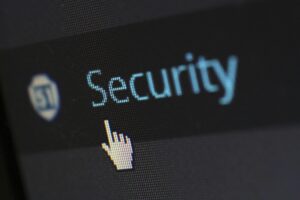 Photo of a computer screen with the word security on it.