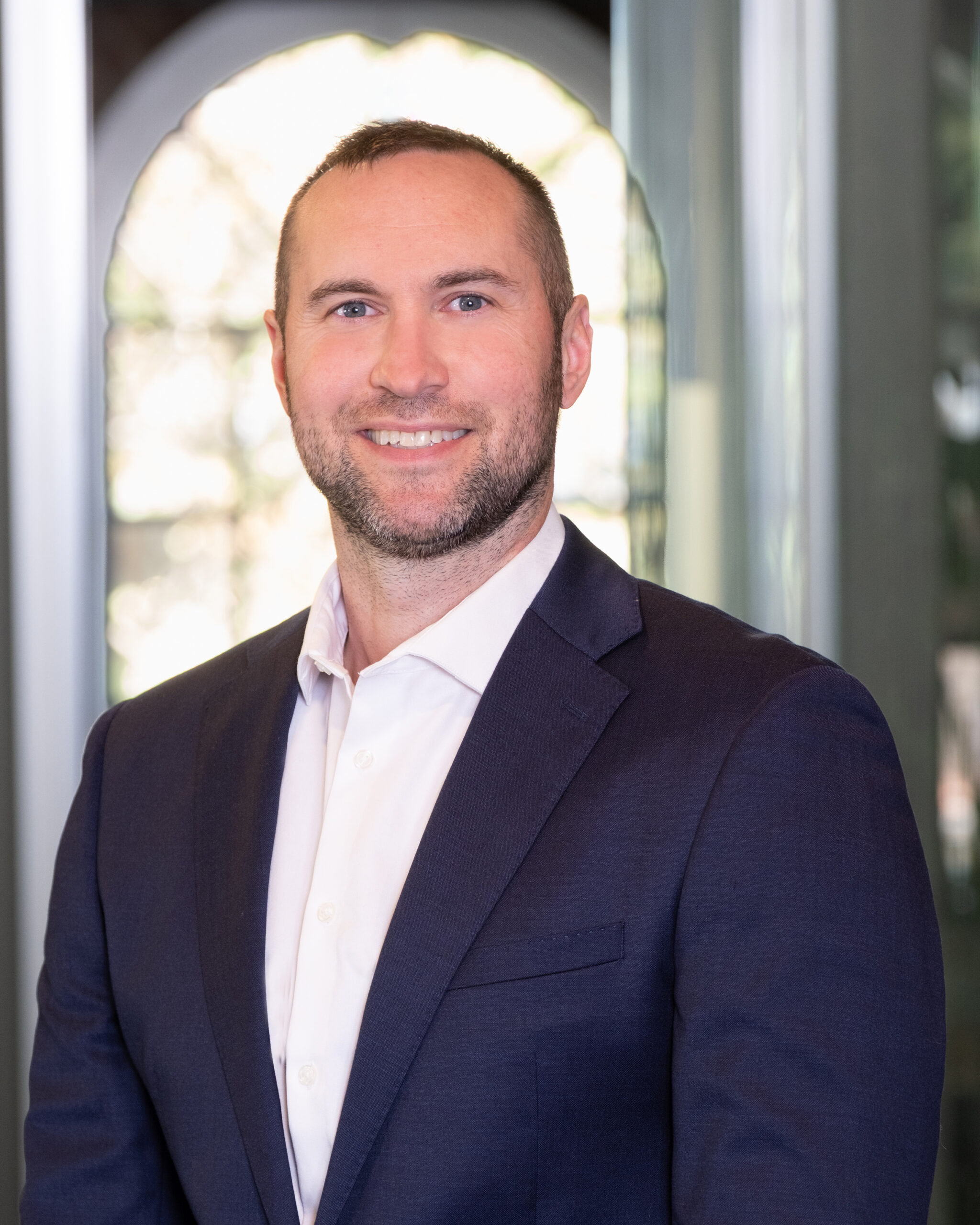A headshot of Adam Zielske, a Certified Financial Planning professional with a background working in the tech sector.